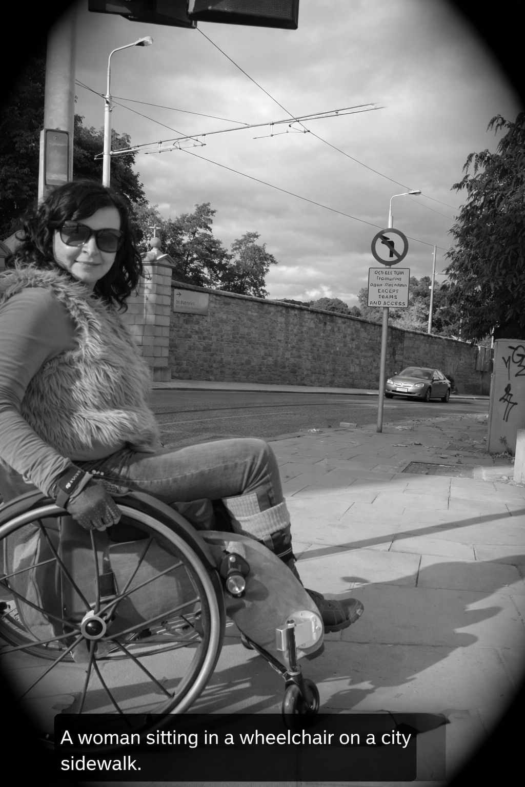Urban Context Woman in a wheelchair on a city sidewalk near a street with traffic signs and a parked car
